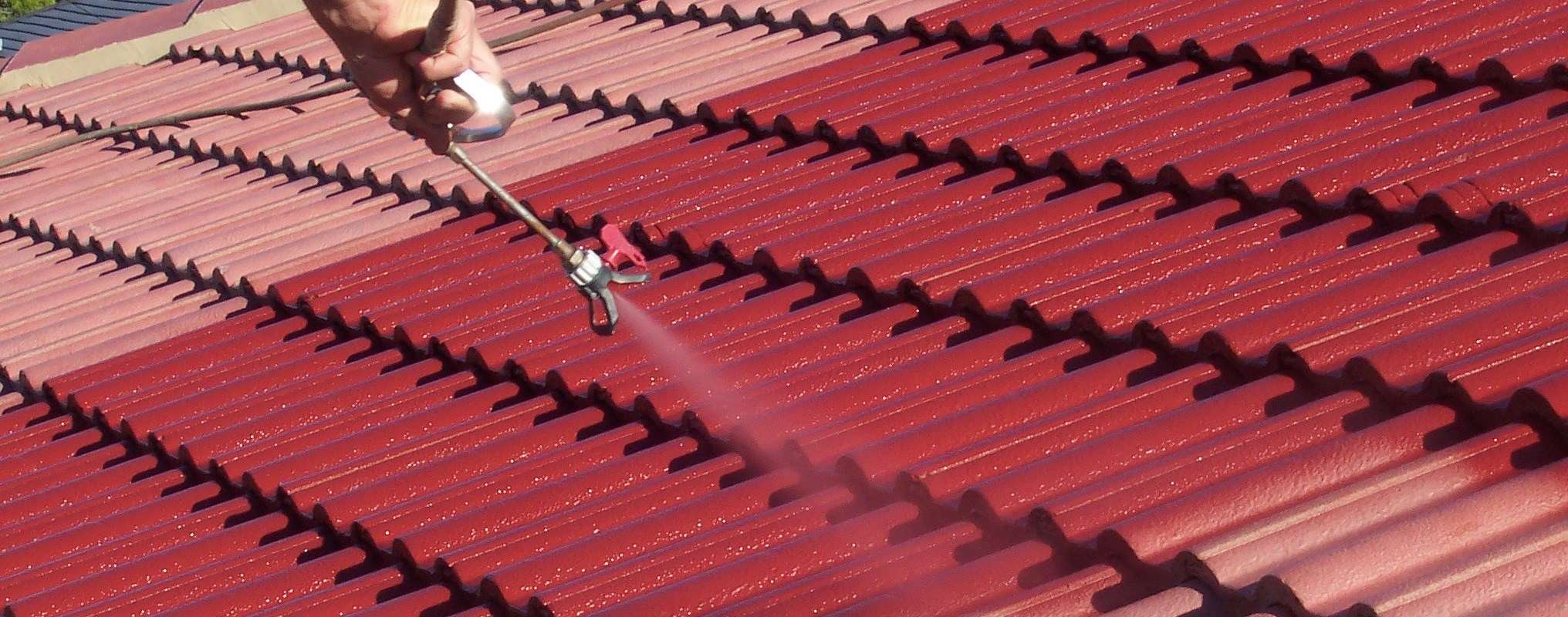 Roof Paint Being Applied With Spray