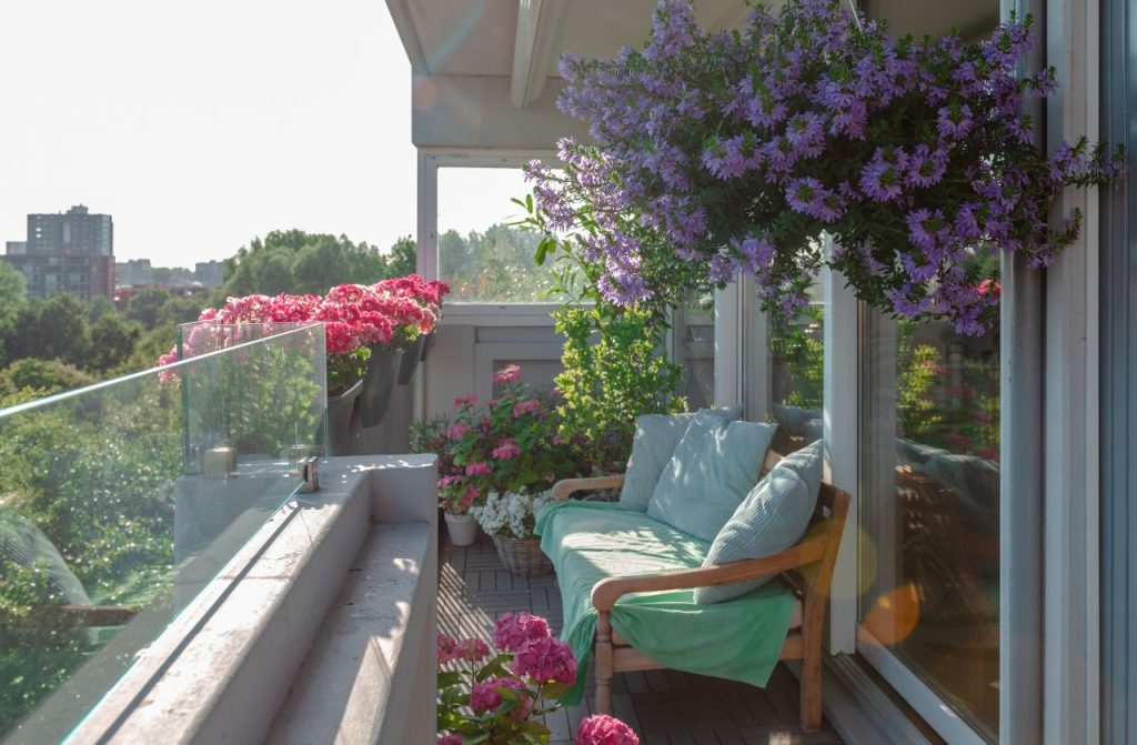 Small balcony filled with flowers